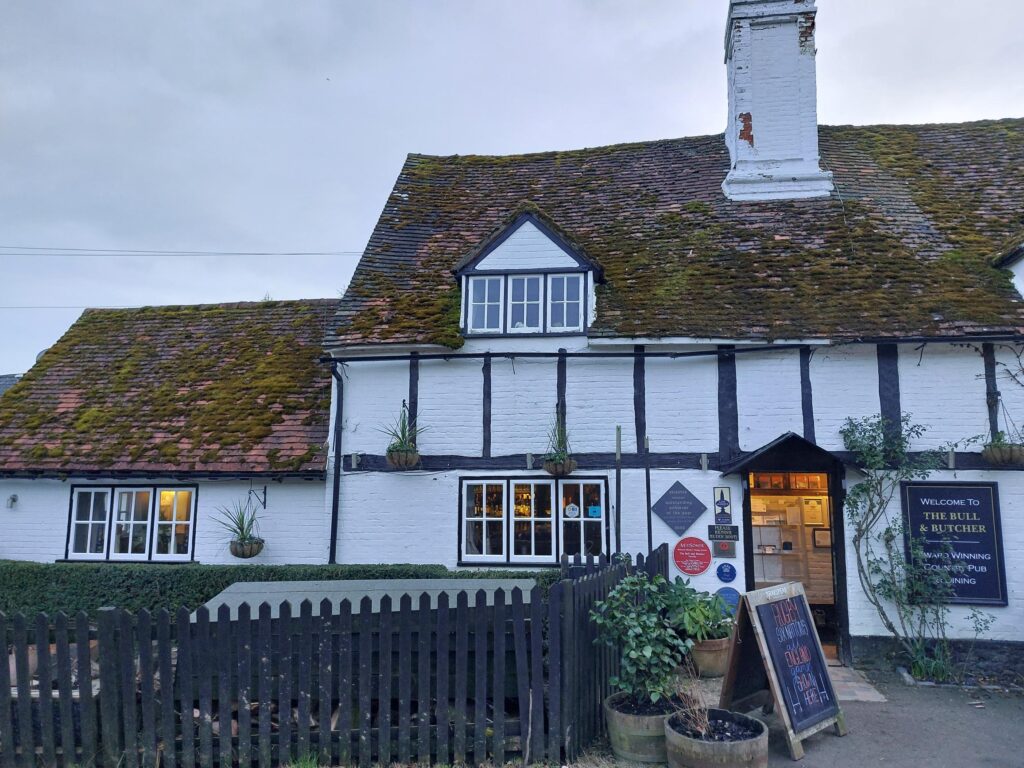 A white timber-framed pub building