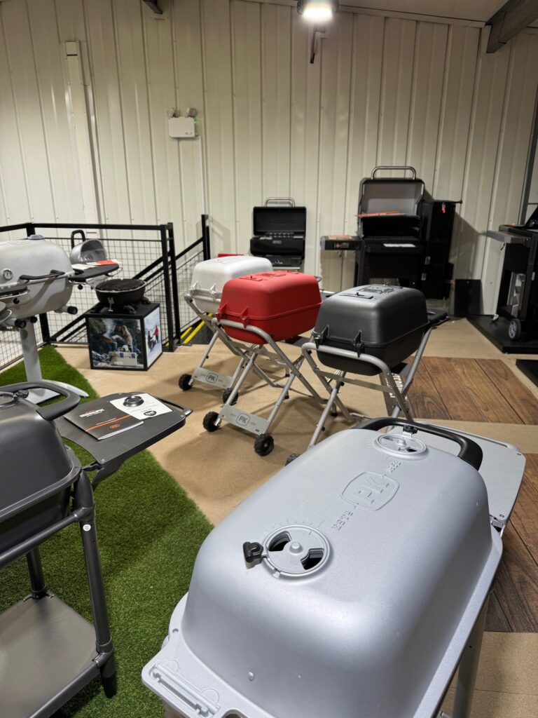 Internal shop shot of PK bbqs in aluminium, red and sliver.